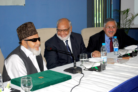 Mian Bashir shares a light moment with the participants
